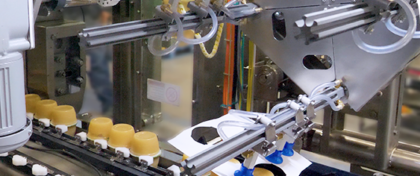 WMIS High Speed Sleever from ADCO Manufacturing - a robust, stainless steel machine designed for high-speed, precision packaging of cartons. Featuring automated product handling, adjustable infeed, and compact footprint suitable for various packaging environments.