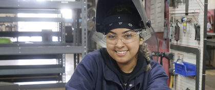 ADCO welder, Yovana smiling for the camera